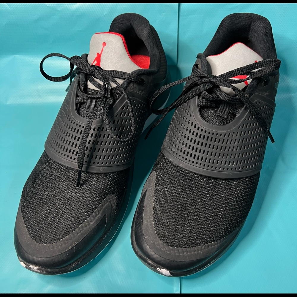 Men’s 10.5 Air Jordan athletic shoe, Black and red